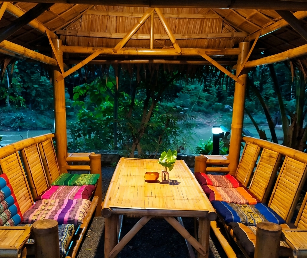 An open-air cafe balcony overlooking the wide Mekong river channel