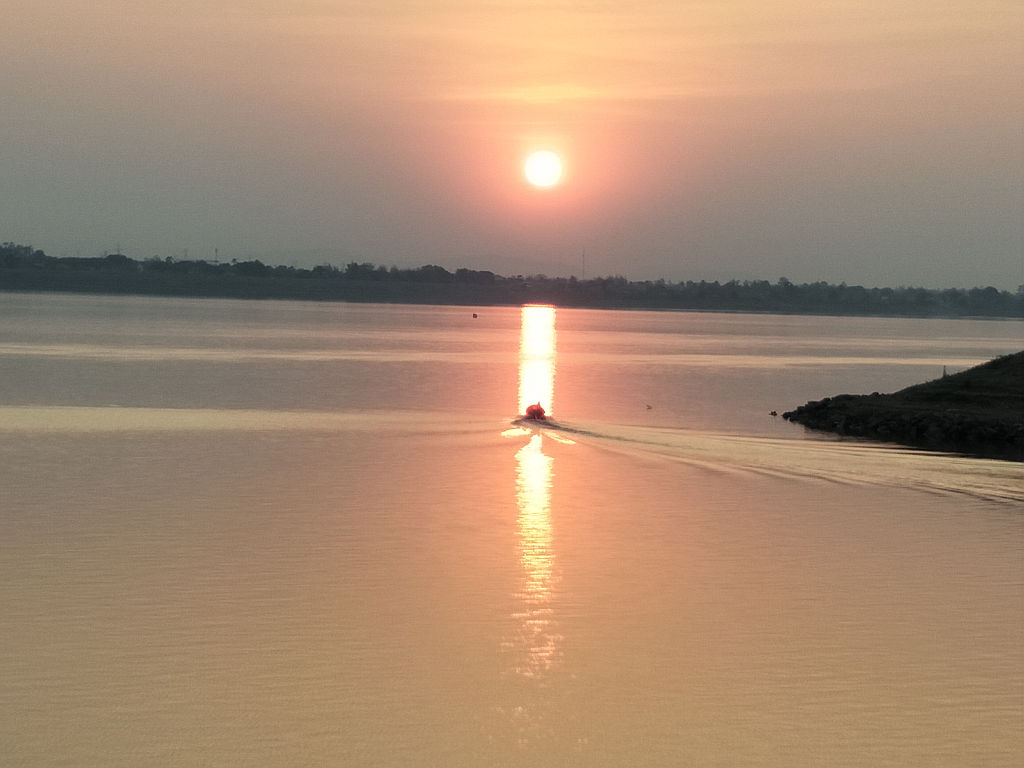 sunset over the Mekong near Chinese temple